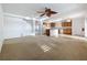 Open-concept living area seamlessly connecting the living room, kitchen, and dining space at 1513 Blue Sky Way, Clermont, FL 34714