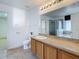 Main bathroom featuring a soaking tub and walk-in shower at 1513 Blue Sky Way, Clermont, FL 34714
