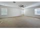 Large main bedroom with lots of natural light and neutral carpet at 1513 Blue Sky Way, Clermont, FL 34714