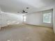 Spacious carpeted main bedroom with lots of natural light at 1513 Blue Sky Way, Clermont, FL 34714