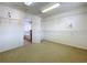 Spacious walk-in closet with carpet, wire shelving, and access to the bathroom at 1513 Blue Sky Way, Clermont, FL 34714