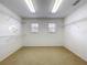 Walk-in closet with shelving and two windows at 1513 Blue Sky Way, Clermont, FL 34714
