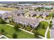 Aerial view of townhomes showing lush landscaping, well-maintained lawns, and community pathways at 16162 Arbor Crest Aly, Winter Garden, FL 34787