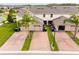 Aerial view of townhomes with paved driveways and well-manicured lawns showcasing the community at 16162 Arbor Crest Aly, Winter Garden, FL 34787