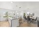 Spacious kitchen with stainless steel appliances, granite island, and an adjacent dining area at 16162 Arbor Crest Aly, Winter Garden, FL 34787