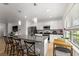 Bright kitchen featuring a granite island, stainless steel appliances, and pendant lighting at 16162 Arbor Crest Aly, Winter Garden, FL 34787