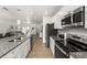 Beautiful kitchen featuring granite countertops, stainless steel appliances, and tiled backsplash at 16162 Arbor Crest Aly, Winter Garden, FL 34787
