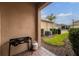 Outdoor patio area featuring a portable stove, brick-paved ground and views of the landscaped backyard at 16162 Arbor Crest Aly, Winter Garden, FL 34787