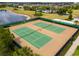 Aerial view of tennis courts in a residential area, highlighting the community's amenities at 16162 Arbor Crest Aly, Winter Garden, FL 34787