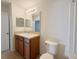 Standard bathroom featuring a single sink vanity and toilet at 1625 Priory Cir, Winter Garden, FL 34787