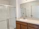 Bathroom featuring walk in shower and single sink at 1625 Priory Cir, Winter Garden, FL 34787