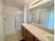 Bathroom with walk in shower and single sink at 1625 Priory Cir, Winter Garden, FL 34787