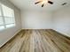 Bedroom with wood flooring, a ceiling fan and a window at 1625 Priory Cir, Winter Garden, FL 34787