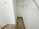 Walk-in closet with wood floors and metal rack shelving at 1625 Priory Cir, Winter Garden, FL 34787