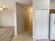 Open entryway leading to a living area and kitchen, featuring tile flooring and ample natural light at 1625 Priory Cir, Winter Garden, FL 34787
