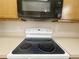 Kitchen features a black stove top, white countertops, and microwave at 1625 Priory Cir, Winter Garden, FL 34787