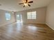 Spacious living room with wood flooring, ceiling fan and sliding doors at 1625 Priory Cir, Winter Garden, FL 34787