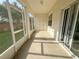 View of screened-in lanai, featuring a patio area with an exterior door at 1625 Priory Cir, Winter Garden, FL 34787