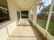 Screened-in patio with view of the backyard and mature trees at 1625 Priory Cir, Winter Garden, FL 34787