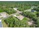 An aerial view showing this property with a large surrounding forest and road access at 16253 Sw 29Th Court Rd, Ocala, FL 34473