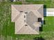 Aerial view of the home showcasing the roof design, lawn and driveway at 16253 Sw 29Th Court Rd, Ocala, FL 34473