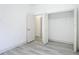 Empty room with open closet doors and new floors at 16253 Sw 29Th Court Rd, Ocala, FL 34473