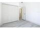 Bedroom featuring closet storage and a door leading to another room at 16253 Sw 29Th Court Rd, Ocala, FL 34473