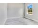 Well-lit bedroom with a neutral color palette and large window creating a bright and inviting space at 16253 Sw 29Th Court Rd, Ocala, FL 34473