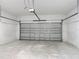 Spacious two car garage with concrete flooring and a modern metal garage door at 16253 Sw 29Th Court Rd, Ocala, FL 34473