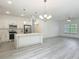 Bright open-concept kitchen with stainless appliances and a large island perfect for entertaining at 16253 Sw 29Th Court Rd, Ocala, FL 34473