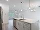 Bright open-concept kitchen with stainless appliances and a large island perfect for entertaining at 16253 Sw 29Th Court Rd, Ocala, FL 34473