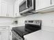 Close-up of kitchen featuring stainless steel appliances and white quartz countertops at 16253 Sw 29Th Court Rd, Ocala, FL 34473