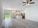 Open concept living space showcases modern lighting, white cabinets and stainless appliances at 16253 Sw 29Th Court Rd, Ocala, FL 34473