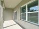 Covered patio area with sliding glass door access and bright overhead lighting at 16253 Sw 29Th Court Rd, Ocala, FL 34473