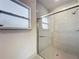 Glass enclosed shower with tile walls and a window for natural light at 16253 Sw 29Th Court Rd, Ocala, FL 34473