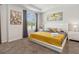 Tranquil bedroom with a tray ceiling, comfortable bed, neutral decor, and large windows at 1632 Tropical Palms Circle, Kissimmee, FL 34747