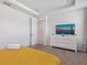 Comfortable bedroom with simple decor, tray ceilings and a large flat screen TV at 1632 Tropical Palms Circle, Kissimmee, FL 34747