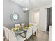 Cozy dining area with modern lighting fixture and decorative mirror, perfect for entertaining at 1632 Tropical Palms Circle, Kissimmee, FL 34747