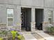 Inviting double-door entryway with stone accents and neutral-toned facade at 1632 Tropical Palms Circle, Kissimmee, FL 34747