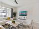 Bright living room with stylish furniture, a large television, and access to the outdoor patio at 1632 Tropical Palms Circle, Kissimmee, FL 34747