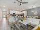 Open floor plan with eat in kitchen, living room, and staircase at 1632 Tropical Palms Circle, Kissimmee, FL 34747
