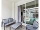 Cozy patio with a sitting area and view of the screened-in pool area at 1632 Tropical Palms Circle, Kissimmee, FL 34747