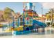 Colorful water park with a large tipping bucket, slides, and various interactive water features, ideal for Gathering entertainment at 1632 Tropical Palms Circle, Kissimmee, FL 34747