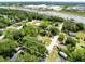 Wide aerial shot of a property near major highways, with mature trees offering privacy and a blend of urban and natural settings at 1701 E Bay St, Winter Garden, FL 34787