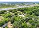 An aerial view of a wooded neighborhood near highway, showing convenience and natural surroundings for potential buyers at 1701 E Bay St, Winter Garden, FL 34787