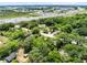 An aerial view of a wooded neighborhood near highway, showing convenience and natural surroundings for potential buyers at 1701 E Bay St, Winter Garden, FL 34787