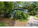 Exterior view of the home with a side yard and driveway at 1701 E Bay St, Winter Garden, FL 34787