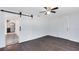 Bedroom featuring a ceiling fan and view into the kitchen at 1701 E Bay St, Winter Garden, FL 34787