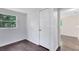 Bedroom space with hardwood floors and access to another room and closet at 1701 E Bay St, Winter Garden, FL 34787