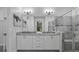Stylish main bathroom with double vanity, granite counters, and a glass-enclosed shower at 18743 Overton St, Orlando, FL 32833